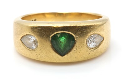 Lot 288 - A gold three stone tsavorite garnet and diamond ring, by Astral Gemstone Talismans
