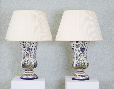 Lot 215 - A pair of polychrome-decorated faience vases