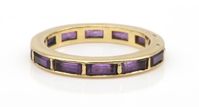 Lot 210 - An 18ct gold amethyst full eternity ring