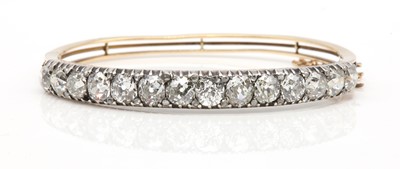 Lot 50 - A late Victorian diamond set hinged bangle