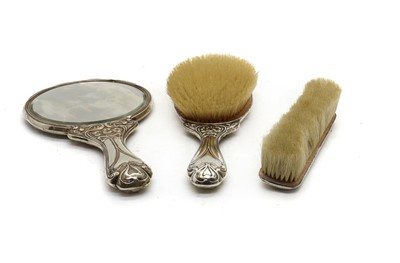 Lot 54 - An Art Nouveau silver mounted dressing table set