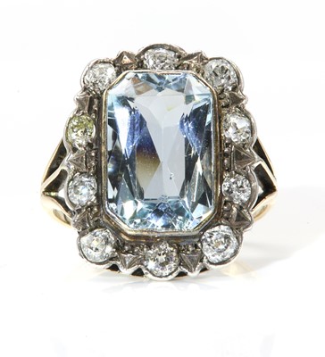 Lot 215 - An aquamarine and diamond rectangular cluster ring