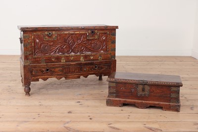 Lot 126 - Two Omani hardwood chests and a brass pestle and mortar
