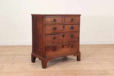 Lot 385 - A George III elm chest of drawers