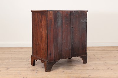 Lot 385 - A George III elm chest of drawers