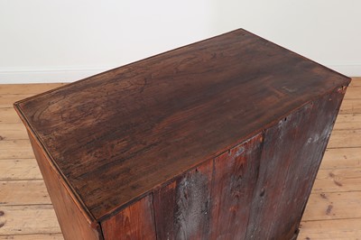 Lot 385 - A George III elm chest of drawers