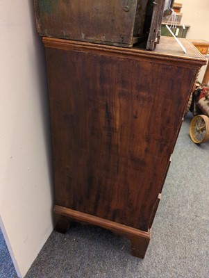 Lot 385 - A George III elm chest of drawers