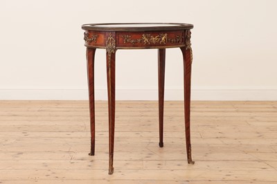 Lot 376 - A transitional-style kingwood and ormolu bijouterie table in the manner of François Linke
