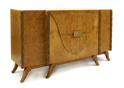 Lot 107 - An Art Deco burr maple inverted breakfront sideboard