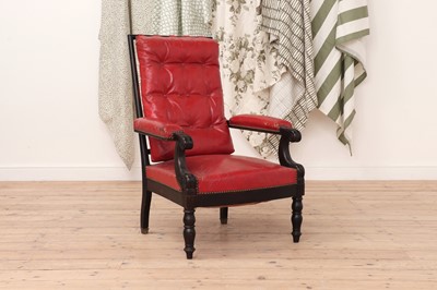 Lot 543 - An ebonised library armchair