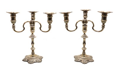 Lot 9 - A pair of silver candelabra