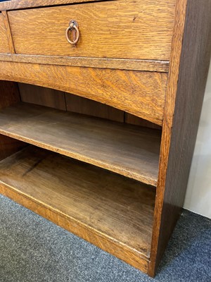 Lot 64 - An Arts and Crafts oak open bookcase