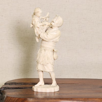 Lot 220 - A Japanese ivory okimono
