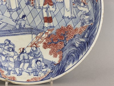 Lot 28 - A Chinese copper red and underglaze-blue charger
