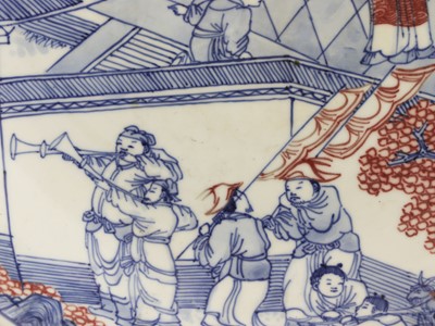 Lot 28 - A Chinese copper red and underglaze-blue charger