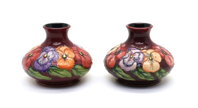 Lot 59 - A pair of Moorcroft pottery ‘Pansy’ pattern vases