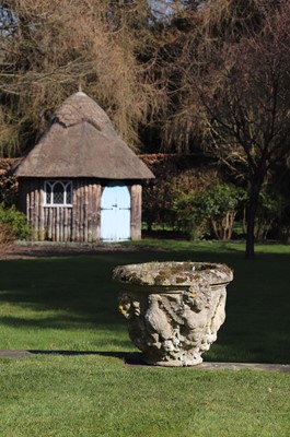 Lot 400 - A pair of weathered stone urns