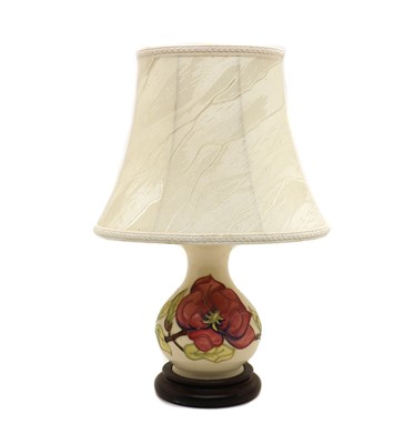 Lot 49 - A small Moorcroft pottery 'Anemone' pattern table lamp