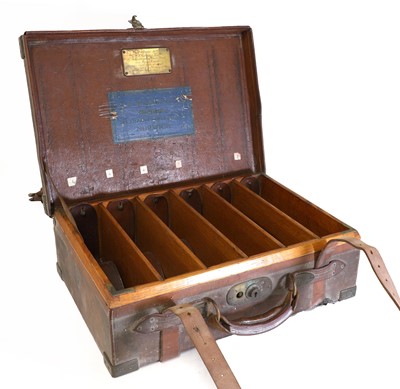 Lot 85 - An oak and leather cartridge magazine