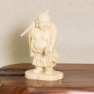 Lot 219 - A Japanese ivory okimono