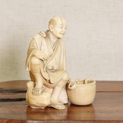 Lot 218 - A Japanese ivory okimono
