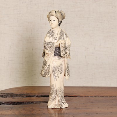 Lot 222 - A Japanese ivory okimono