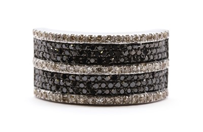 Lot 79 - A 9ct white gold diamond and black diamond ring