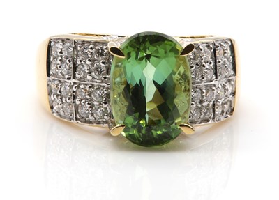 Lot 329 - An 18ct gold green tourmaline and diamond ring