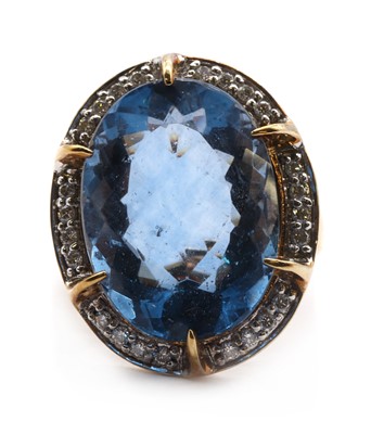 Lot 282 - A 9ct gold colour change fluorite and diamond halo cluster ring