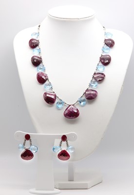 Lot 447 - A continental ruby and blue topaz necklace and earring suite