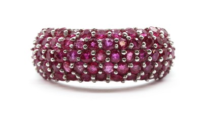 Lot 89 - A 9ct white gold ruby set bombé band ring