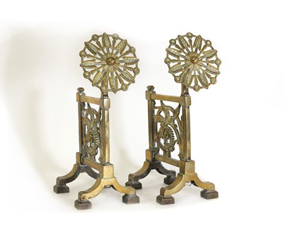 Lot 10 - A pair of cast brass andirons