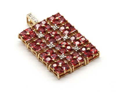 Lot 93 - A 9ct gold ruby and diamond pendant