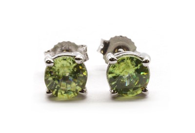 Lot 235 - A pair of 18ct white gold single stone sphene stud earrings