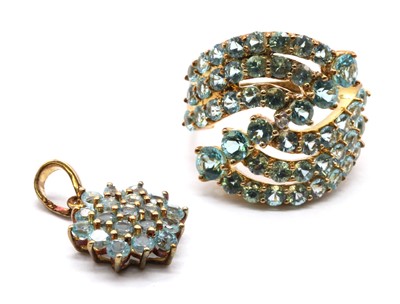 Lot 254 - A 9ct gold diamond and apatite three row crossover ring