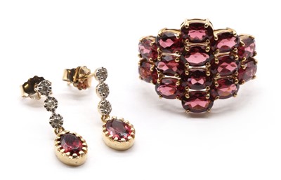 Lot 175 - A pair of gold rhodolite garnet and diamond drop earrings