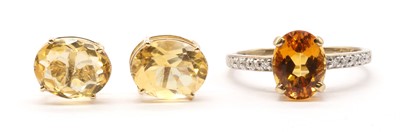 Lot 127 - A 9ct gold citrine and diamond ring