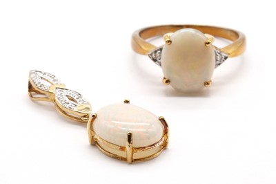 Lot 322 - A 9ct gold opal and diamond three stone ring