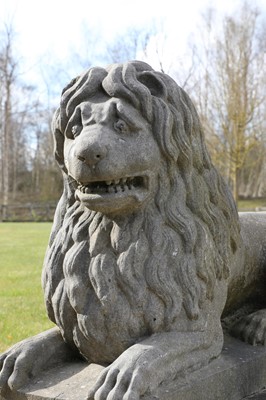 Lot 252 - A large pair of carved Belgian fossil marble recumbent lions