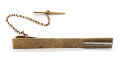 Lot 472 - A Continental two colour gold tie slide