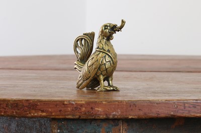 Lot 115 - A bronze oil lamp in the form of a cockerel