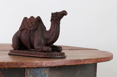 Lot 87 - A carved hardwood inkwell in the form of a seated camel