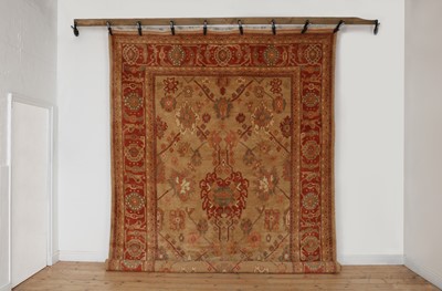 Lot 585 - An Oushak wool carpet