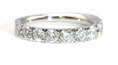 Lot 381 - A diamond set half eternity ring