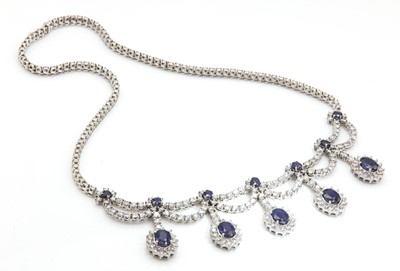 Lot 428 - An Italian white gold sapphire and diamond swag and fringe necklace