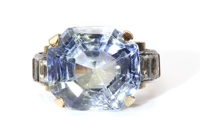 Lot 213 - A single stone sapphire ring with white sapphire set shoulders, c.1940