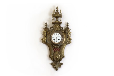 Lot 178 - A brass cartel clock