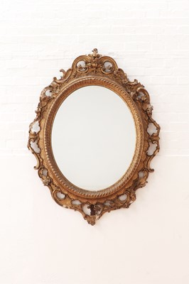 Lot 177 - A large Victorian oval gilt gesso wall mirror