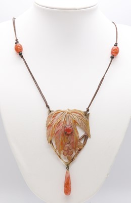 Lot 125 - An Art Nouveau French carved and painted horn pendant, by Elizabeth Bonté, c.1900