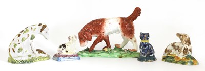 Lot 179 - A Staffordshire creamware figure of a gun dog